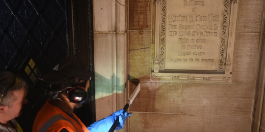 Detailed view of facade cleaning process for the Trinity Chapel Complex